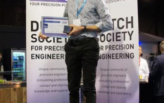 Kees Verbaan proudly showing the certificate and trophy that come with the Ir. A. Davidson Award 2021. (Photo: Julie van Stiphout)